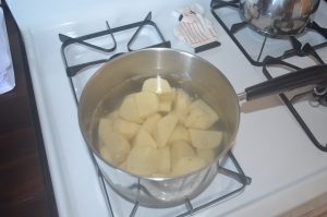 cut up potatoes in pot
